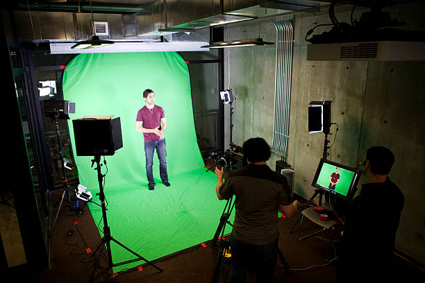 Home camera man filming actor on set.